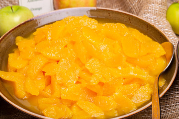 Peeled mandarin slices in deep plate for breakfast