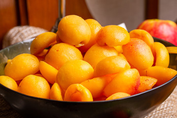 Half apricot fresh in deep plate, served for breakfast