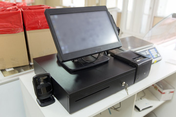 Cash equipment on the store counter - monitor, computer, customer display, fiscal drive, cash register, cash drawer