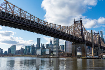 Fototapeta na wymiar Queensboro Bridge along the East River with the Midtown Manhattan Skyline in New York City