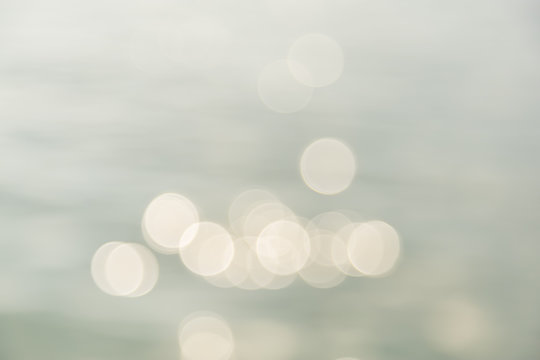 Abstract photo blurred of out of focus of water under sunlight with bokeh using for wallpaper or background