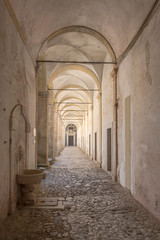 summer light under San Lorenzo Certosa cloister covered walkway , Padula, Italy