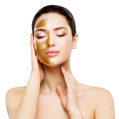 Woman Beauty Gold Mask , Beautiful Girl applying Golden Skin Cosmetic to Face