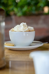 Cappuccino and Coffee with Latte Art and Thick Cream and Sugar On A Wooden Table In South Africa 
