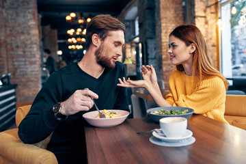 young couple having dinner in restaurant