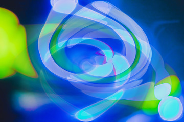 Abstract bright blured colored bokeh. Lights of the night city background.