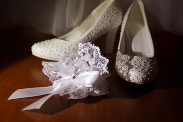 wedding shoes, rings on pillow