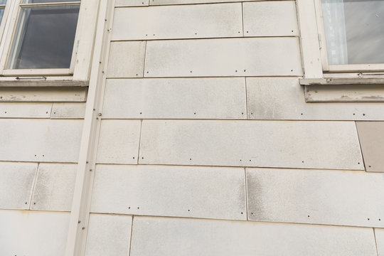 Outdoor wall tiles made of asbest, on an old house in Norway