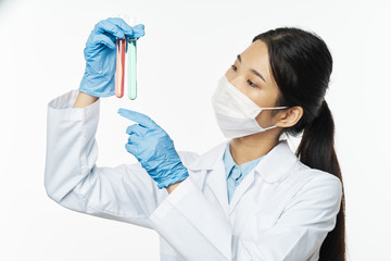 scientist in laboratory with test tubes