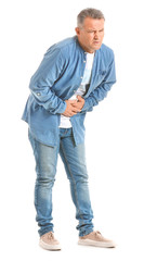 Fototapeta premium Mature man suffering from abdominal pain on white background