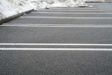 empty parking lot with snow removed