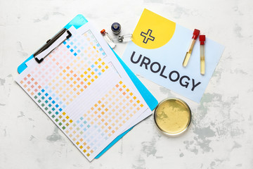 Paper sheet with text UROLOGY, Petri dish and medicines on light background