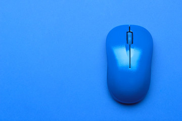 Blue PC mouse on color background