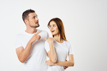 young couple in t-shirts chatting