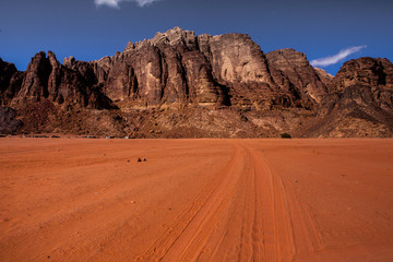 Wadi Rum Desert in Jordan. On the Sunset. Panorama of beautiful sand pattern on the dune. Desert landscape in Jordan.