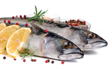 .raw fish with lemon on a white background