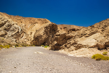 sand stone canyon rocky landscape wasteland of Negev Israeli desert in dry summer time season without rains