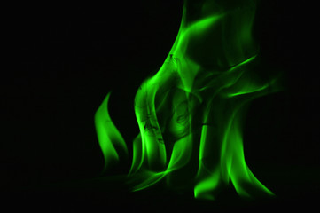 Beautiful fire green flames on a black background.