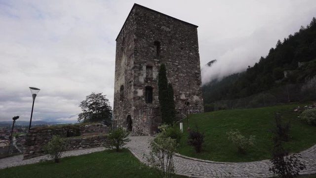 Establishing, revealing shot, starting under a tree, approaching an ancient castle in Rattenberg, Austria.