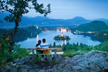 couple of man and woman on a bench in Bled, Slovenia