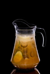 Pitcher with lemonade made of cucumbers and grated ginger