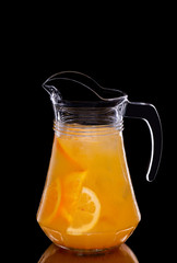 Pitcher with orange syrup and orange slices