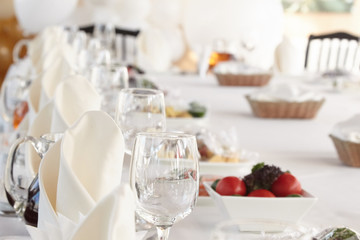 A luxurious covered table for the holiday in an expensive restaurant.	