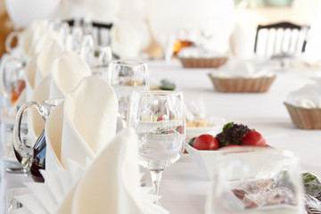 A luxurious covered table for the holiday in an expensive restaurant.	