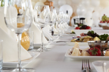 A luxurious covered table for the holiday in an expensive restaurant.	