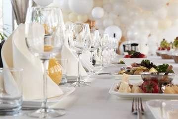 A luxurious covered table for the holiday in an expensive restaurant.	