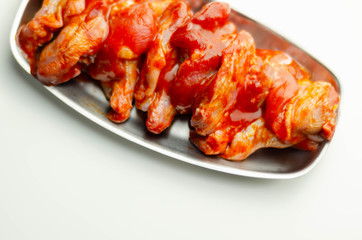 Raw and fresh chicken wings in a Chinese marinade