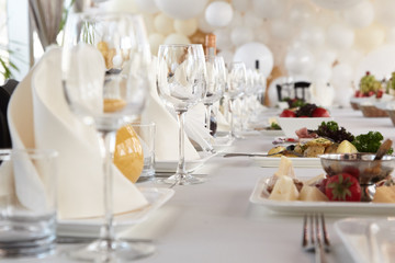 A luxurious covered table for the holiday in an expensive restaurant.	