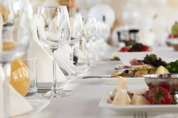 A luxurious covered table for the holiday in an expensive restaurant.	