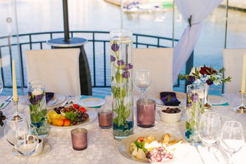 A Banquet table is served in the restaurant with cold appetizers.  Birthday party, party, business reception, wedding, romantic dinner