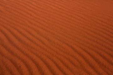 Wadi Rum Desert in Jordan. On the Sunset. Panorama of beautiful sand pattern on the dune. Desert landscape in Jordan.