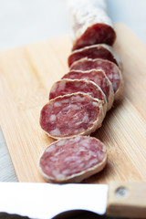 sausage sliced on wood, meat and sausages