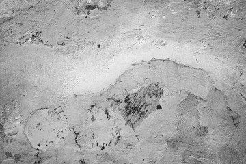 Texture of a concrete wall with cracks and scratches which can be used as a background