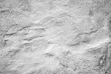 Texture of a concrete wall with cracks and scratches which can be used as a background