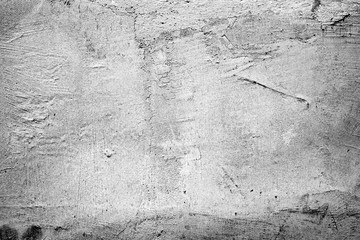Texture of a concrete wall with cracks and scratches which can be used as a background