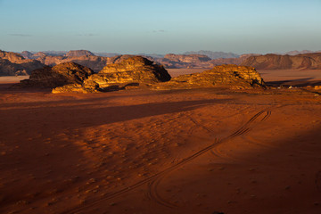 Wadi Rum Desert in Jordan. On the Sunset. Panorama of beautiful sand pattern on the dune. Desert landscape in Jordan.