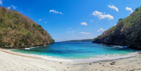Pandan Secret Beach on Nusa Penida, Bali, Indonesia With Calm Turquoise Ocean Waves and Peaceful White Sand