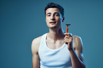 portrait of young man with glass of red wine