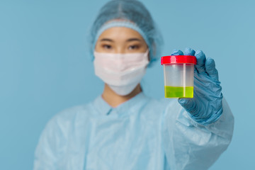 scientist in laboratory with test tubes