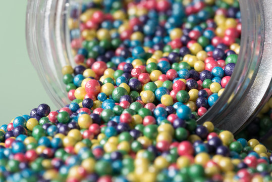 Confectionery Sprinkles Spilled from a Jar
