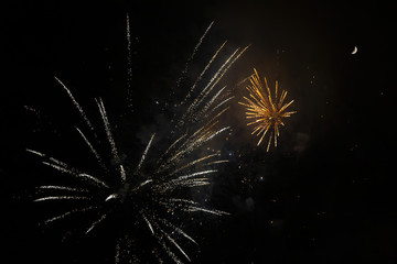 Amazing orange fireworks on night sky. New years eve celebration. Ceske Budejovice, Czech republic