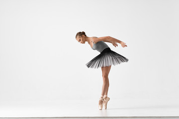 ballet dancer posing on white background