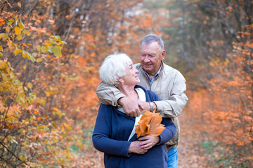 Two senior loving people hugs and talk