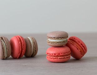 Food. macaroons red and brown, beige background