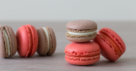 Food. macaroons red and brown, beige background