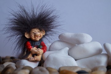 Background with a cute troll and stones